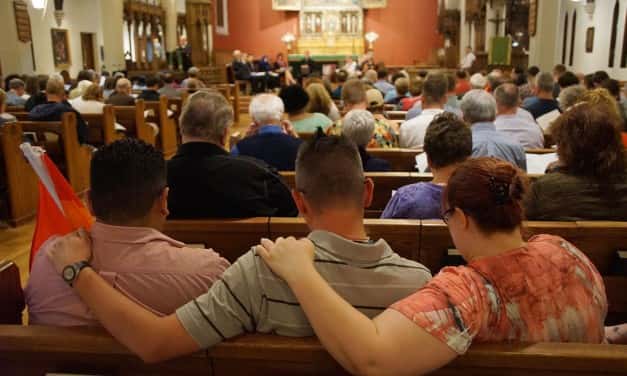 Photo Essay: Bell tolls mark Orlando loss during vigil