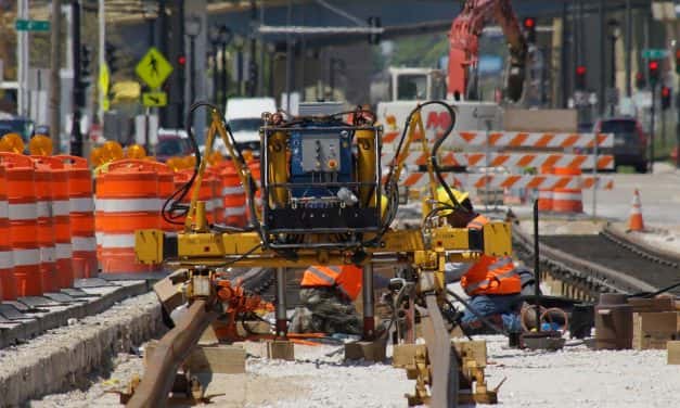 Crews reshape roadway as first streetcar rails installed