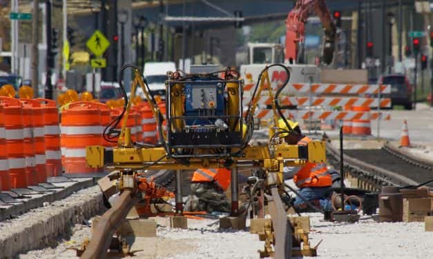 Crews reshape roadway as first streetcar rails installed