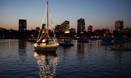 Vessels decorated with light sail in inaugural Venetian Boat Parade