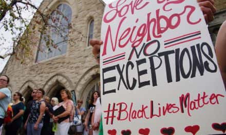 Photo Essay: Faith group stands up to racism with silent vigil