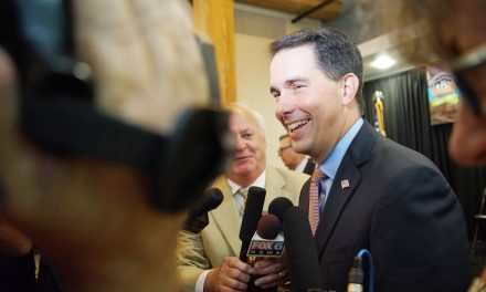 Outgoing Governor Scott Walker signs controversial legislation as parting snub to voters