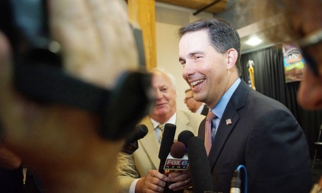 Outgoing Governor Scott Walker signs controversial legislation as parting snub to voters