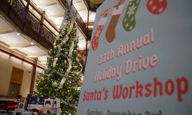 Santa’s helpers prepared holiday gift drive donations for USO party