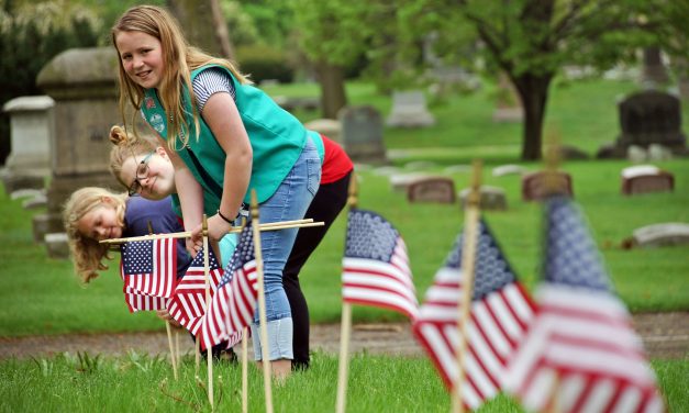 Girl Scouts navigate cemetery labyrinth to plant American flags in honor of veterans