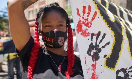 Marching for CPAC: Youth group chalks messages around City Hall demanding police accountability