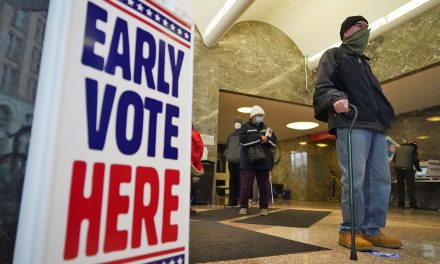 Milwaukee voters line up amid an escalating pandemic to cast early in-person ballots