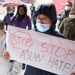 Milwaukee residents hold vigil by City Hall to demand an end of the violence targeting Asian Americans