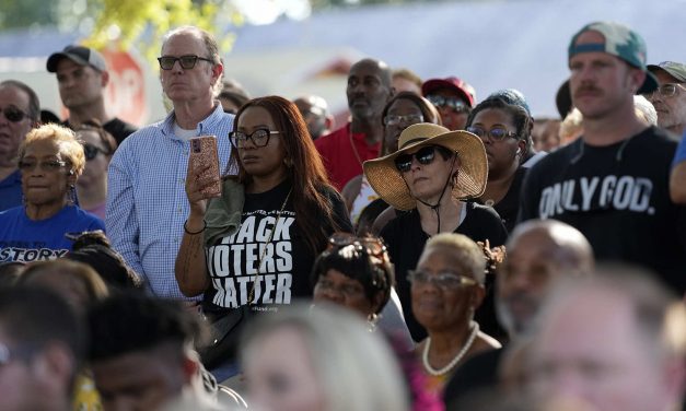 Hundreds of people deride Governor Desantis during address at vigil mourning racist killings in Florida