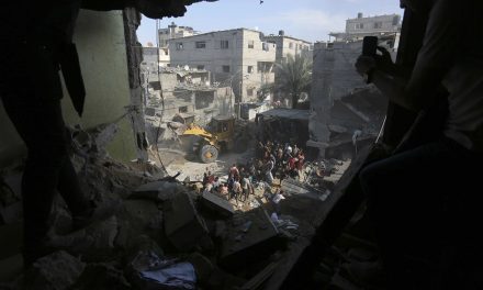 Israeli ground forces battle Hamas militants as airstrikes level apartments in Gaza refugee camp