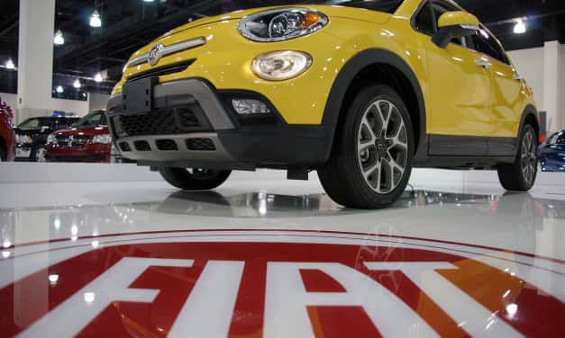 Visitors kick the tires at Auto Show