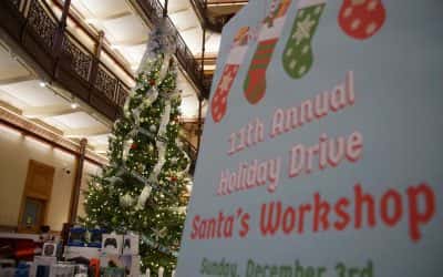 Santa’s helpers prepared holiday gift drive donations for USO party