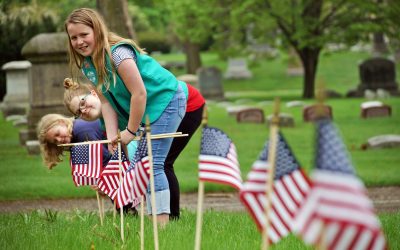 Girl Scouts navigate cemetery labyrinth to plant American flags in honor of veterans
