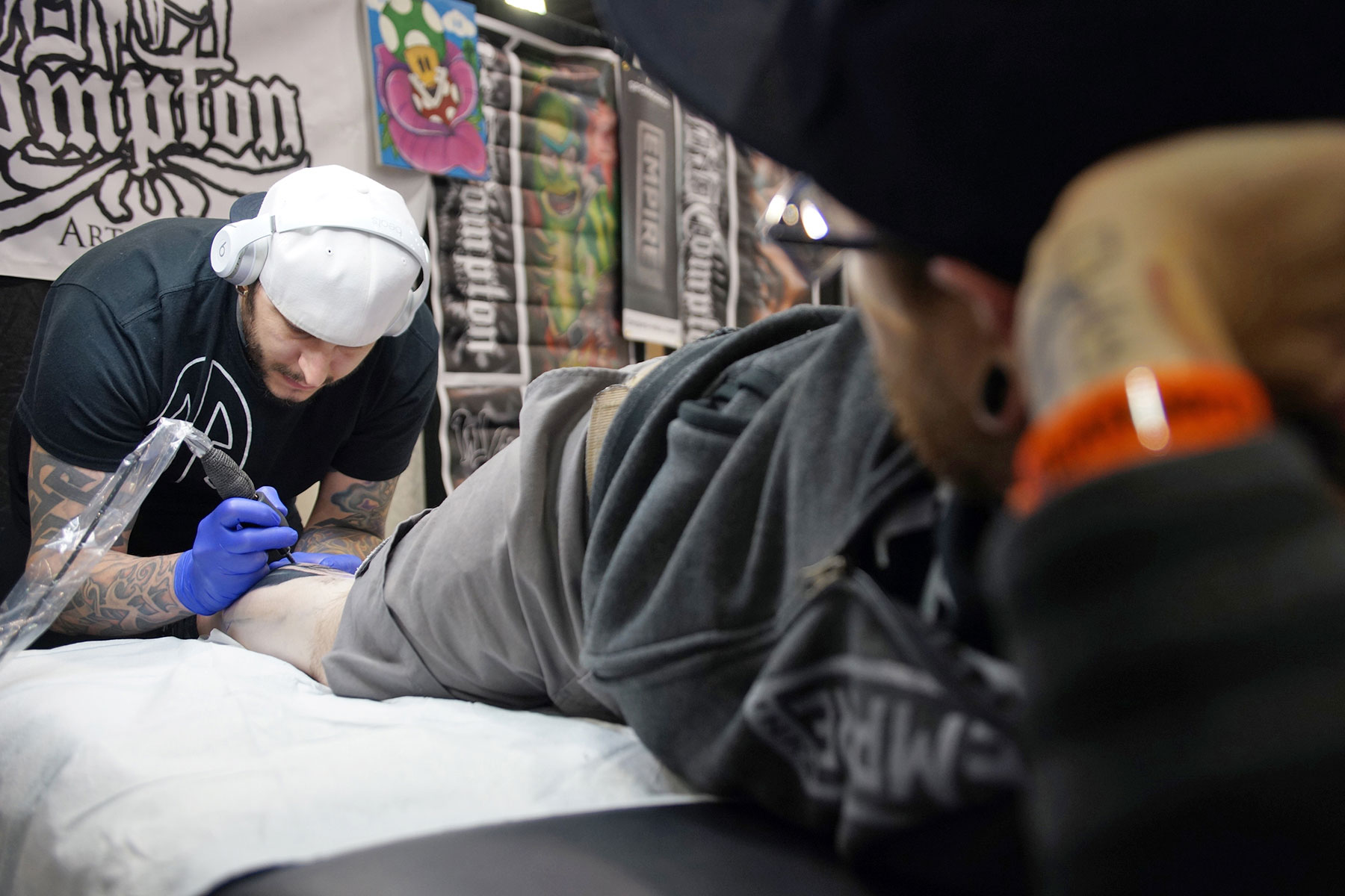 Art collectors get colorful body modifications with tattoos at annual