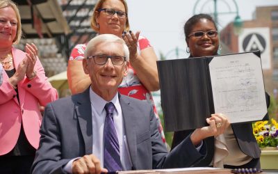 Governor Tony Evers visits Milwaukee to sign law expanding electric transportation options