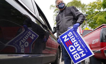Milwaukee’s Latino voters pick up Biden-Harris yard signs to declare their election day support
