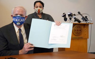 Healing a racial division: Mayor Tom Barrett signs ordnance extending MLK Drive into downtown