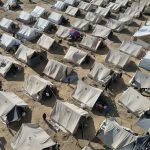 Reawakening old traumas: Squalid tent camp in southern Gaza takes in Palestinians fleeing war