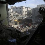 Israeli ground forces battle Hamas militants as airstrikes level apartments in Gaza refugee camp