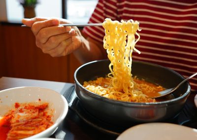 People,Using,Chopsticks,To,Eat,Ramyeon,Or,Korean,Instant,Noodles